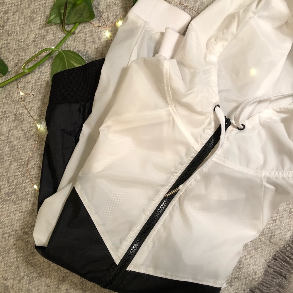 Zip up black and white athletic rain jacket